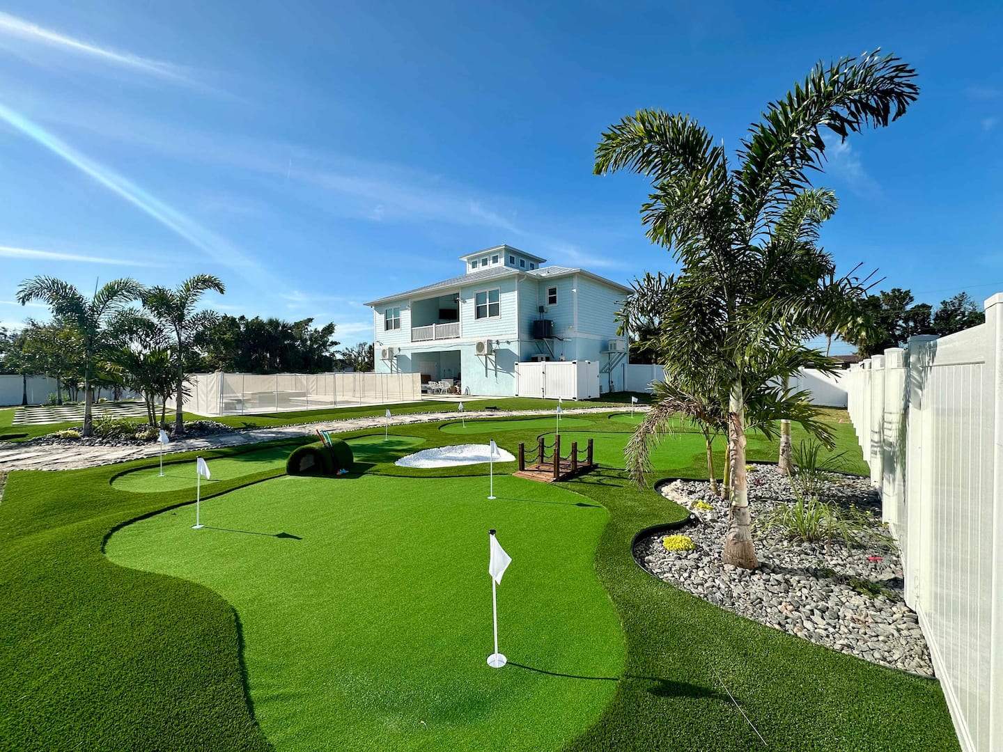 Seaside Boca resort-style pool with lounge chairs and tropical landscaping Placida Florida vacation rental